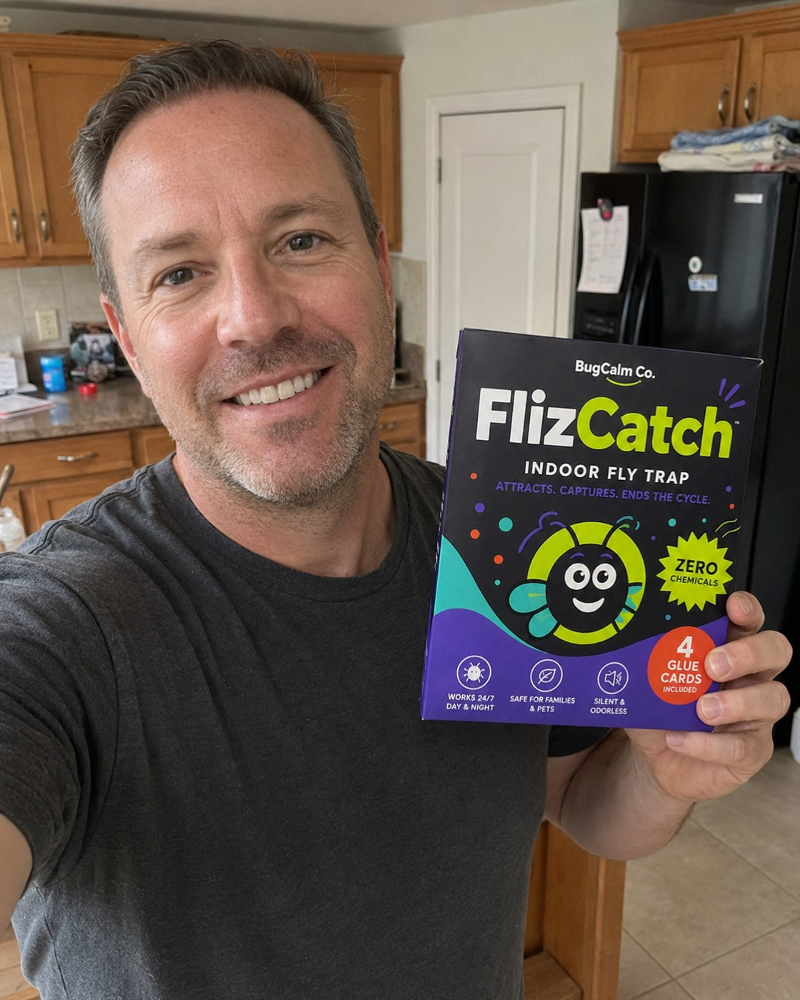 Verified FlizCatch customer holding the starter box in his kitchen