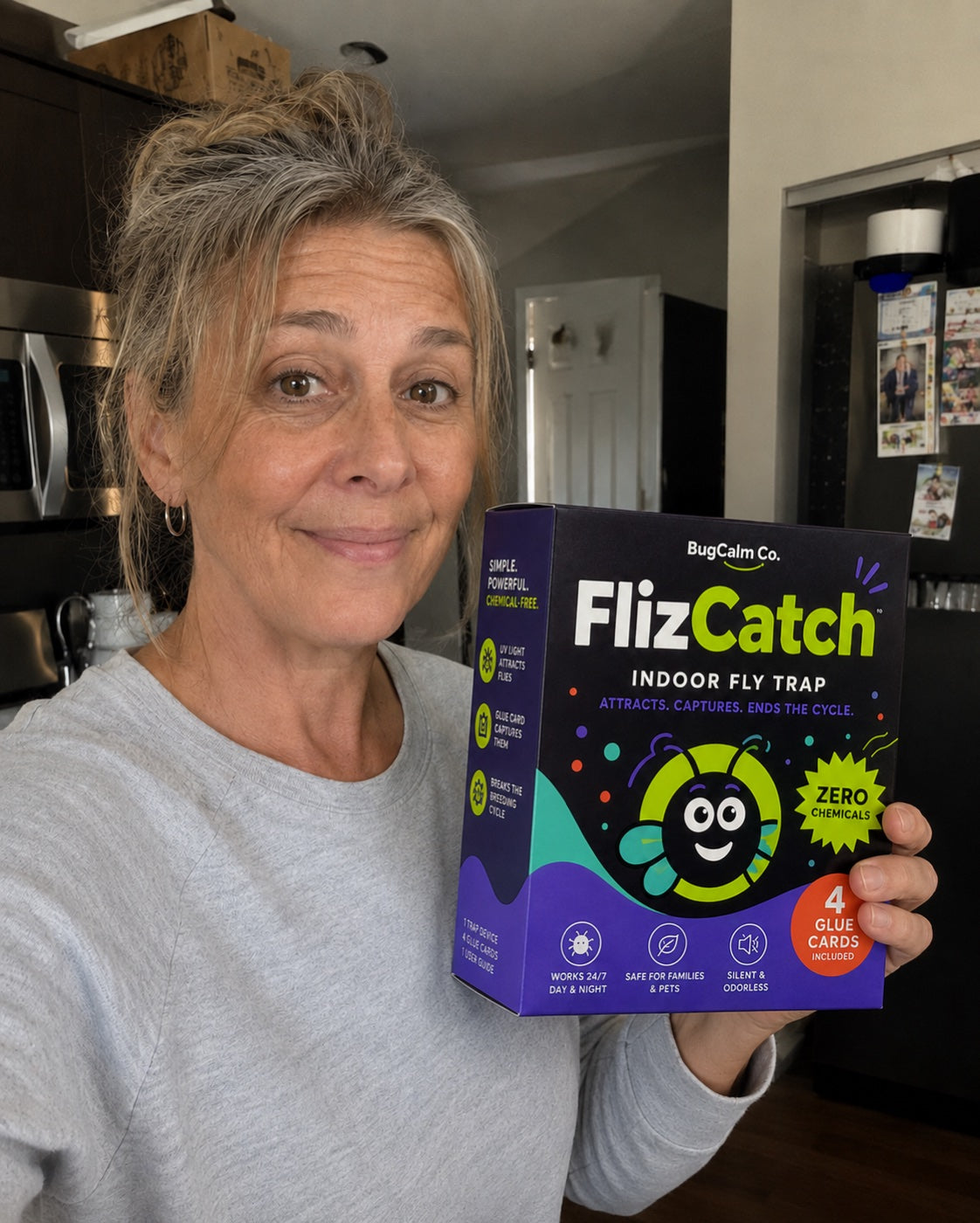 Verified customer holding the FlizCatch starter box at home